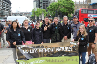 Mass lobby crew with banner London