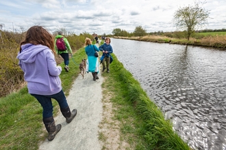 Family walking along canal