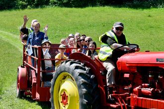 Group on a tractor at Pam's Pools