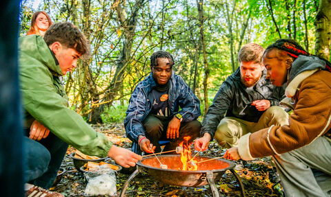 Young people around fire