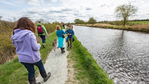 Family walking along canal
